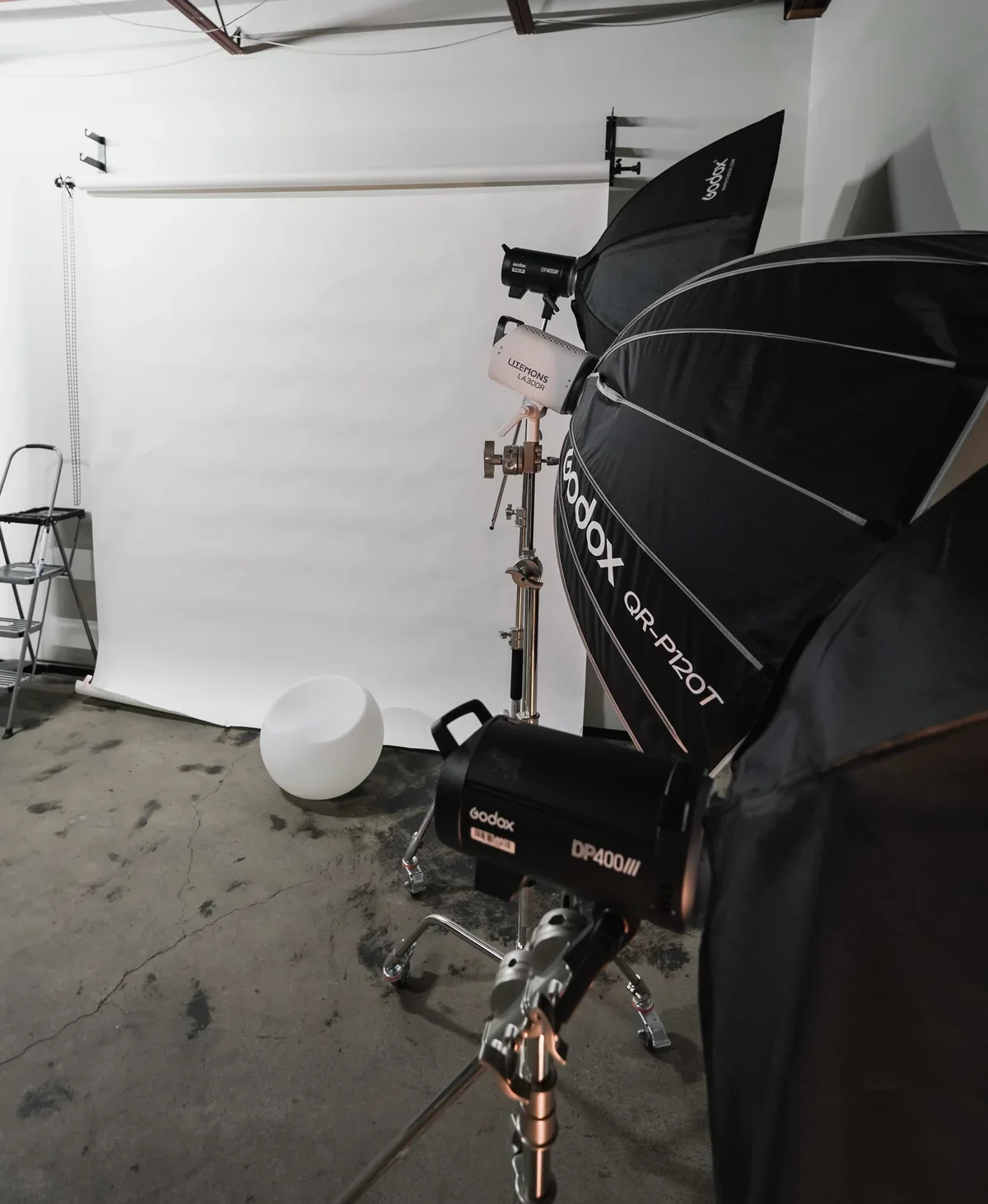 Final Lap studio rental with Godox professional lighting and white seamless backdrop